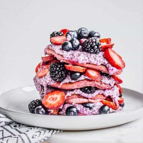 pink pancakes with chia pudding and fresh berries