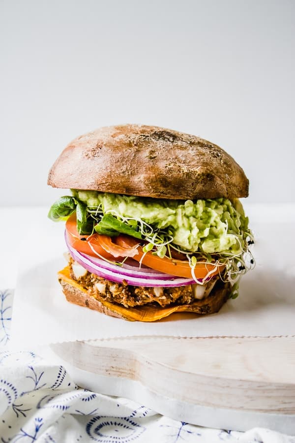 vegan bbq guacamole burger on sweet potato bun