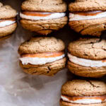 apple butter whoopie pies lined up in a baking pan all in a row