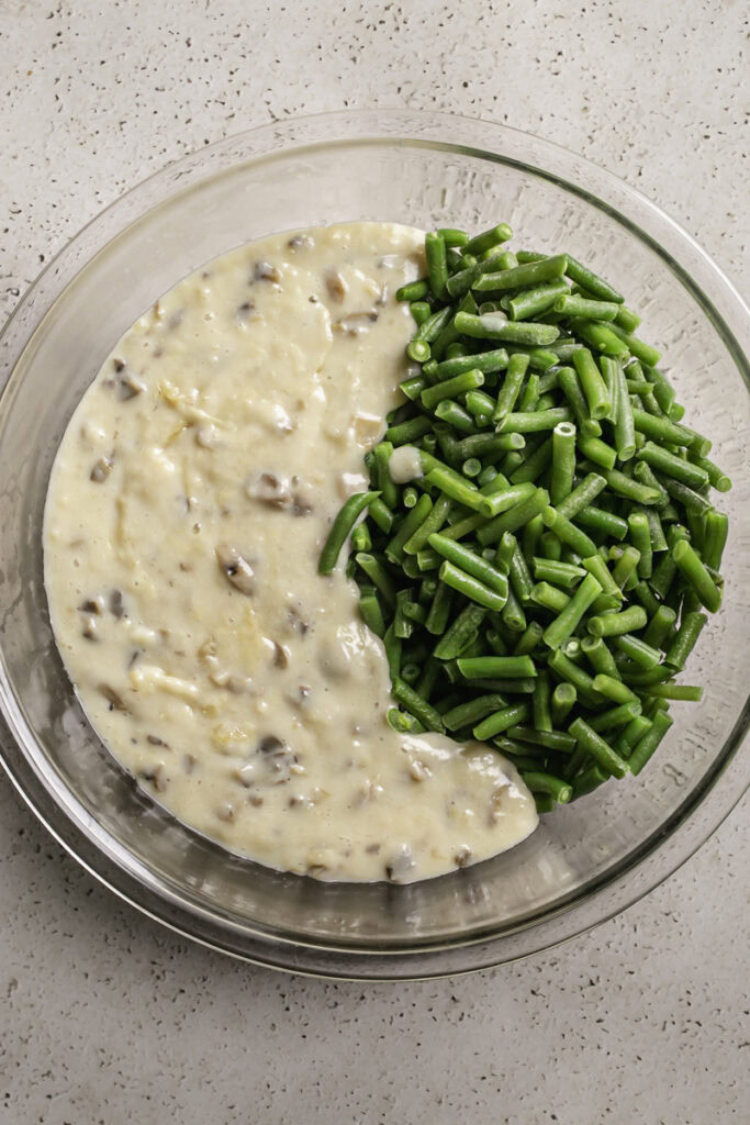 homemade creamy mushroom roux poured in a large bowl with green beans