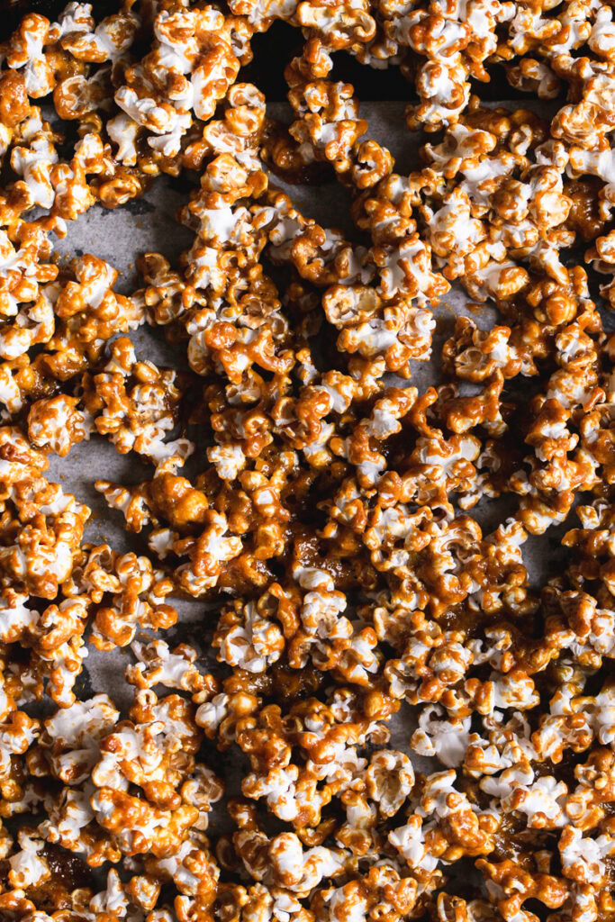 a full shot of caramel popcorn on a baking tray