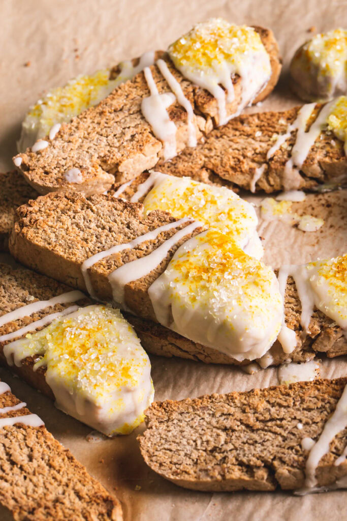 3/4 close up view of lemon vanilla biscotti stacked on top of one another