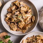 two bowls of gluten-free pappardelle with wild mushroom Ragù