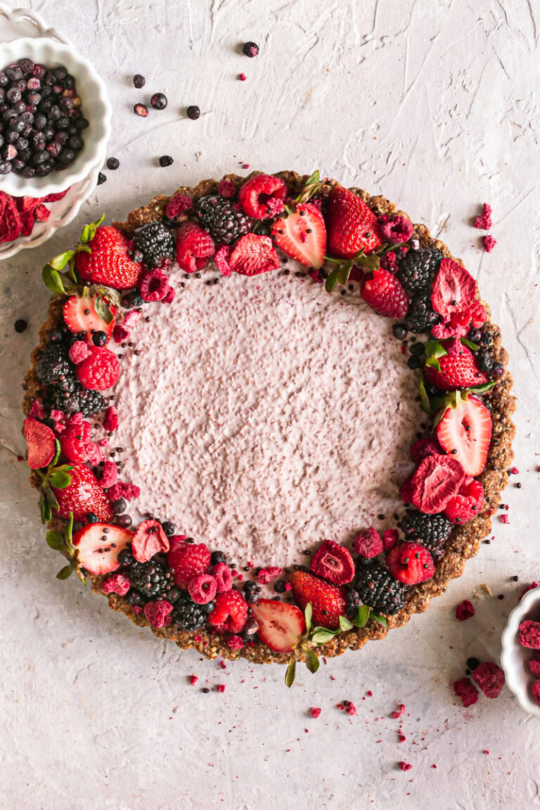 a round yogurt chia tart topped with fresh fruit