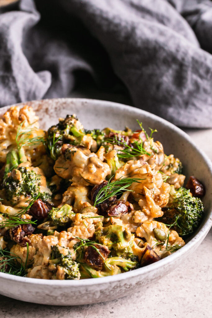 3/4 close up shot of a bowl of tahini harissa cauliflower