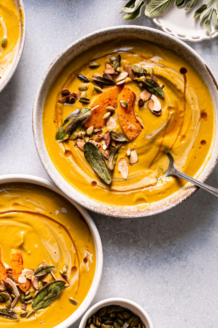 two bowls of roasted butternut squash carrot soup