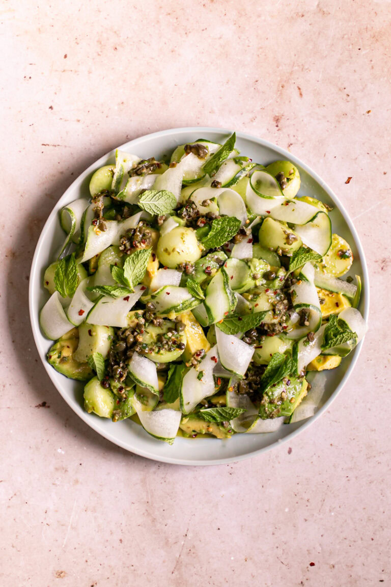 a plate filled with Honeydew Avocado Cucumber Crudo