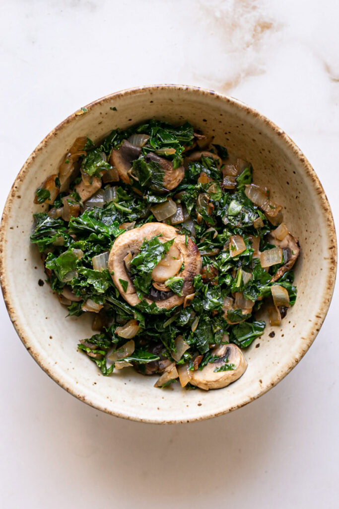 the sautéed mushroom, onion, and kale filling in a bowl