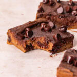 close up of a Vegan Chocolate Chip Sweet Potato Blondie with a bite taken out of it