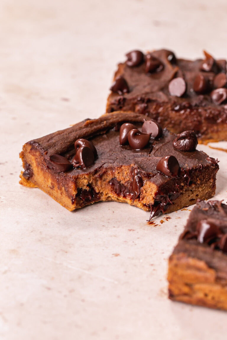 close up of a Vegan Chocolate Chip Sweet Potato Blondie with a bite taken out of it