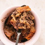 Vegan GLuten-Free French Toast in a Mug with some scooped on a spoon