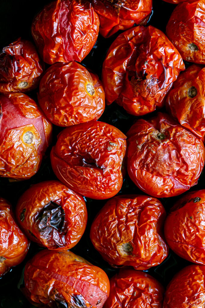photo of roasted tomatoes on a baking sheet 