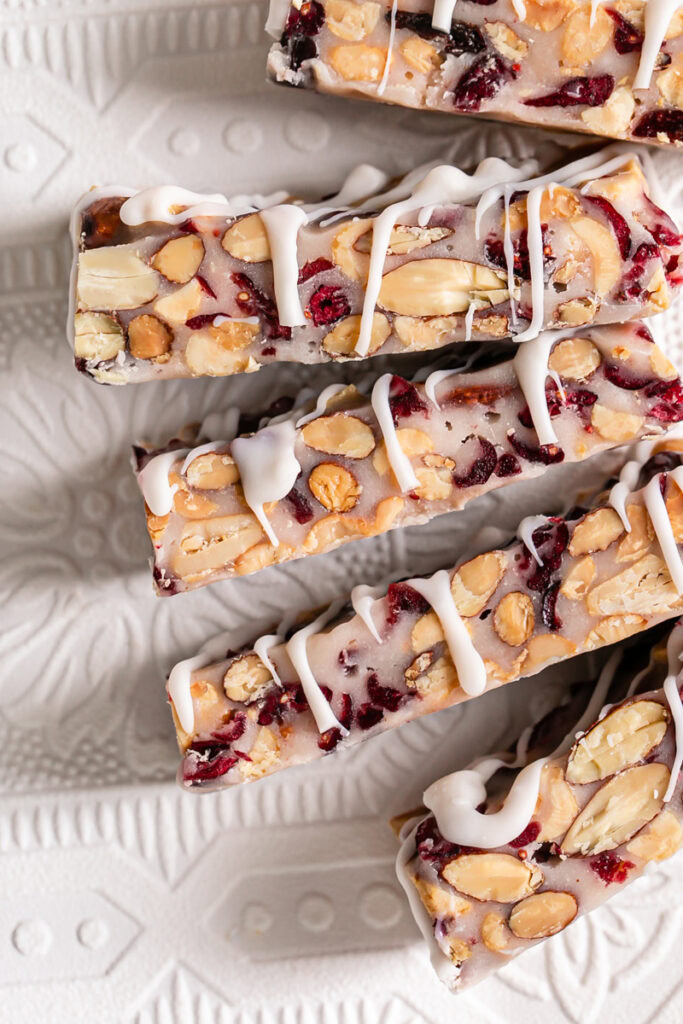 White Chocolate Amaretto Trail Mix Truffle Bars on their side to reveal the trail mix filling