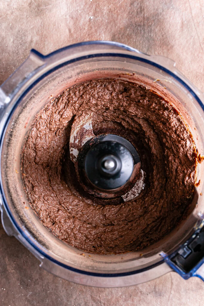 blended up brownie batter in a food processor