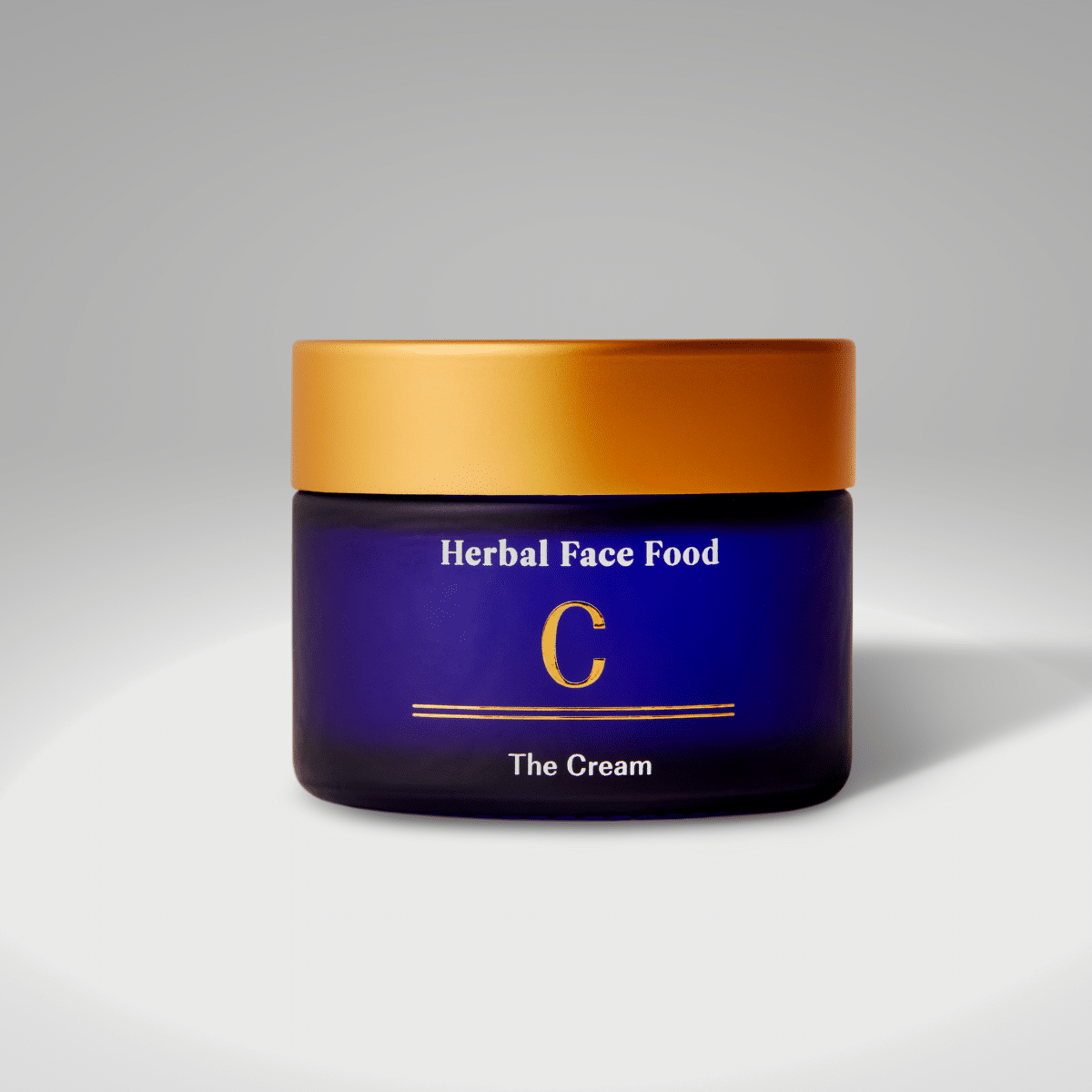 a bottle of herbal face food cream surrounded by plants
