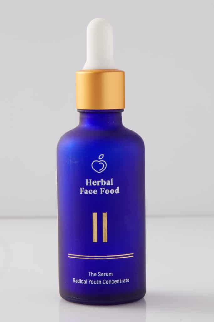 a bottle of herbal face food serum 2