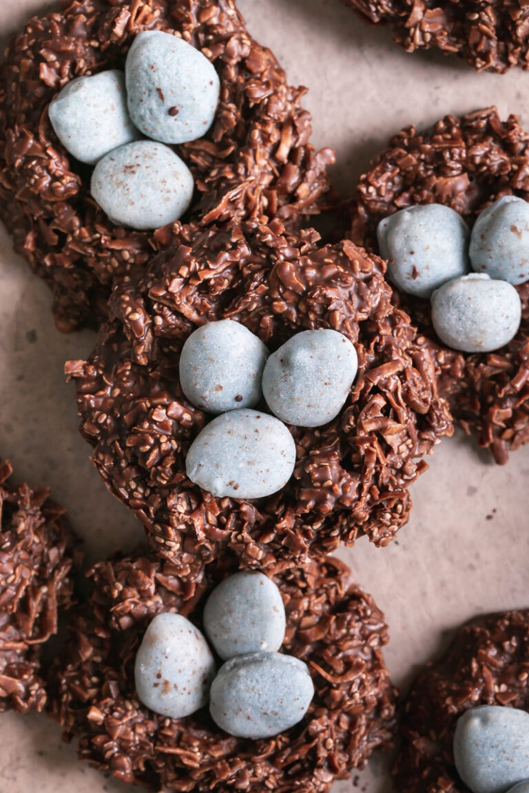 close up of Toasted Coconut Chocolate Bird's Egg Nest Cookies filled with three robin's egg white chocolate covered almonds in each nest