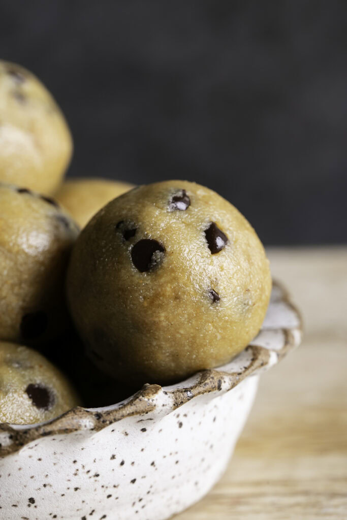 close up of an almond flour chocolate chip cookie dough bite.