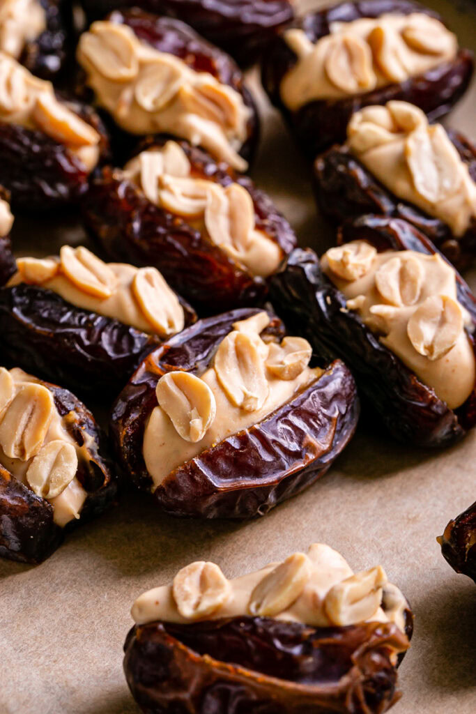 whole dates, pitted and filled with peanut butter yogurt and topped with peanuts