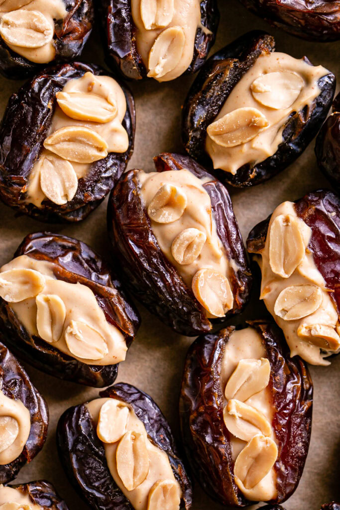 whole dates, pitted and filled with peanut butter yogurt and topped with peanuts
