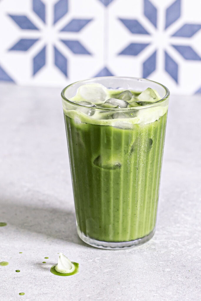 a glass of iced matcha latte