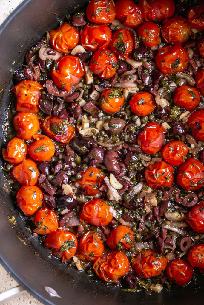 the cooked ingredients to make the Cherry Tomato Puttanesca in a large stock pot