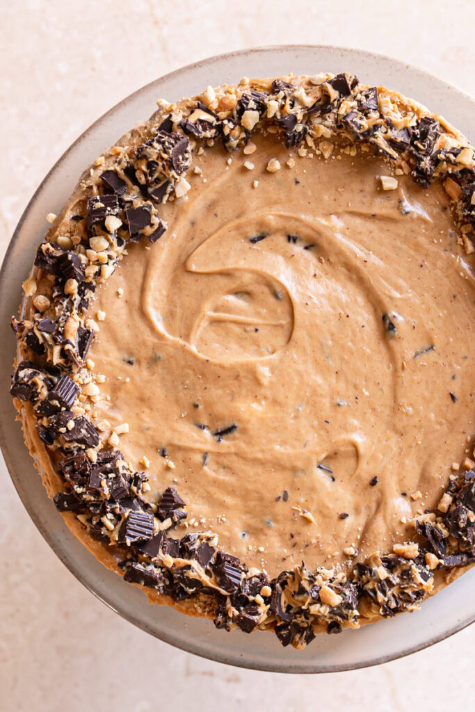 overhead shot of No-Bake Peanut Butter Cup Pie garnished with chopped peanut butter cups and peanuts