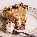 a slice of No-Bake Peanut Butter Cup Pie with a bite on a fork next to it