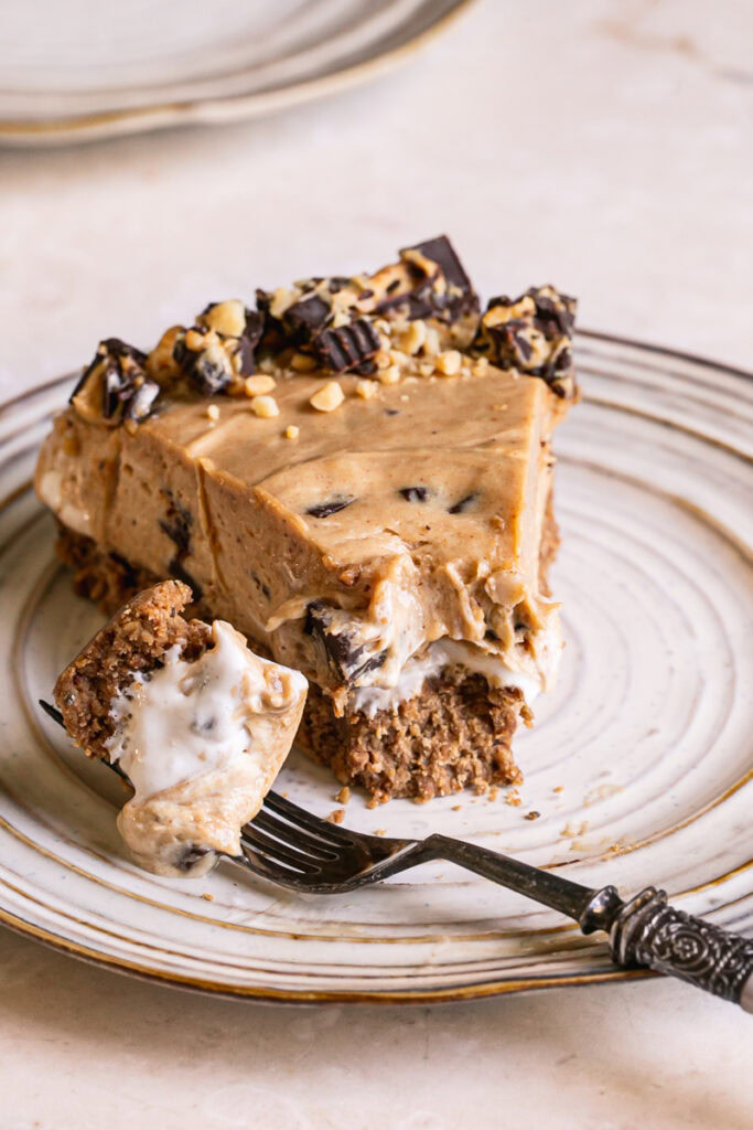 a slice of No-Bake Peanut Butter Cup Pie with a bite on a fork next to it