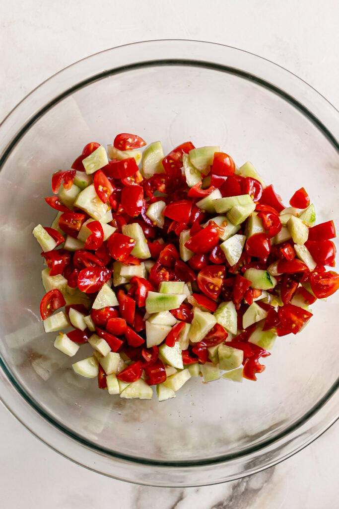 diced tomato and cucumber in a large bowl