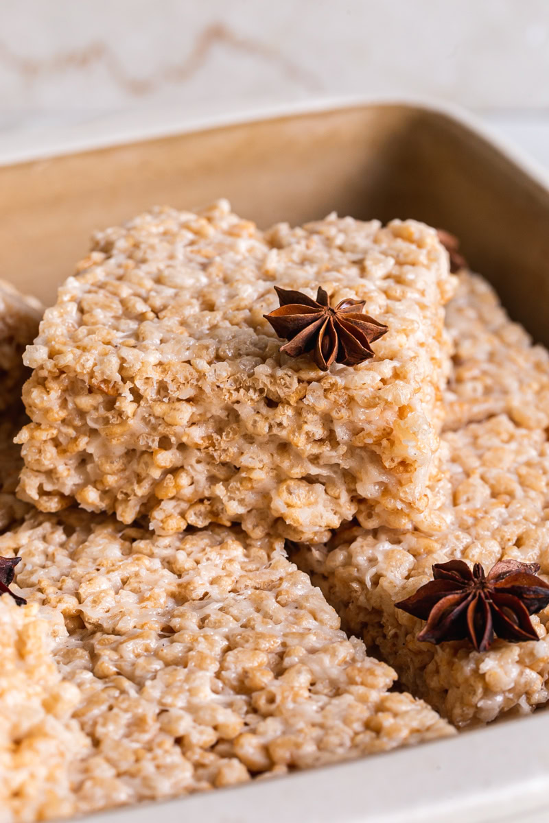 chai Rice Krispie treats sliced into squares piled in a square baking dish garnished with star anise