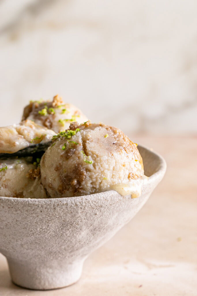 close up of No-Churn Key Lime Pie Ice Cream in a bowl with 2 other scoops