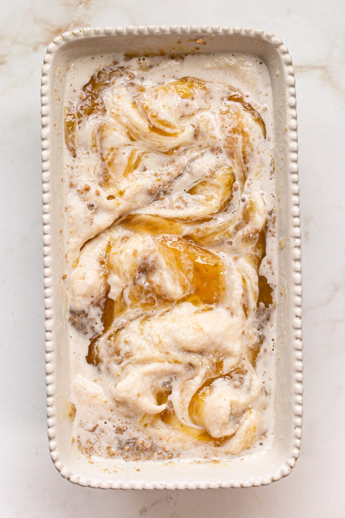 vegan vanilla ice cream, lime curd and cookie dough crumble swirled together in a loaf pan