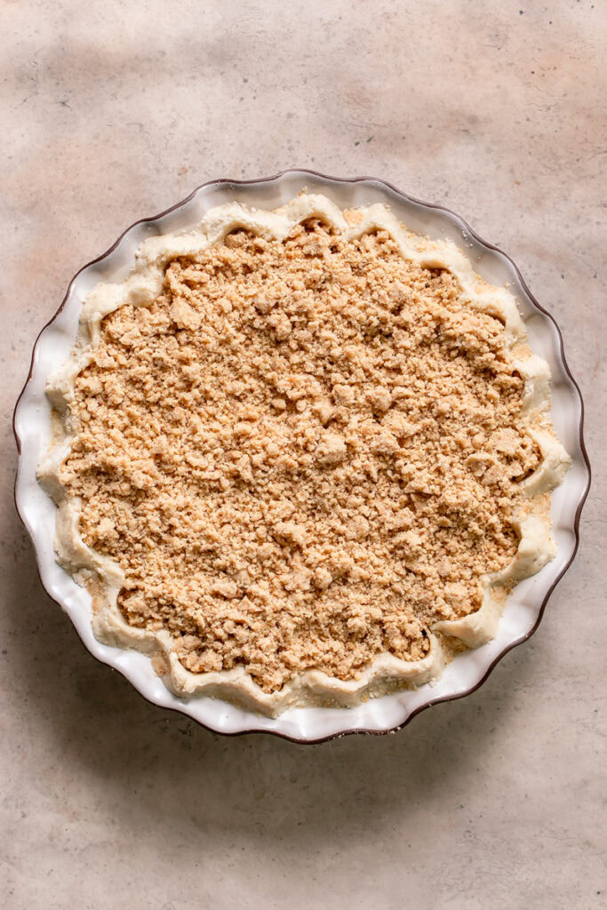 a whole apple pie sprinkled with gluten-free vegan crust crumble (dutch apple pie)
