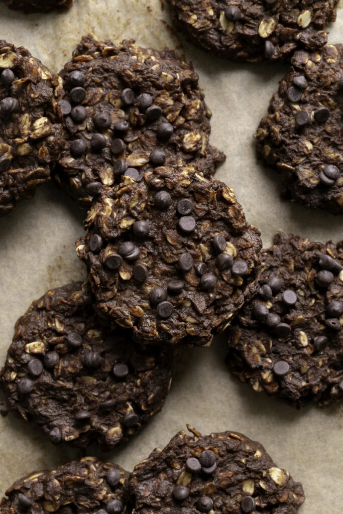 no-bake pumpkin brownie oatmeal cookies stacked on top of one another