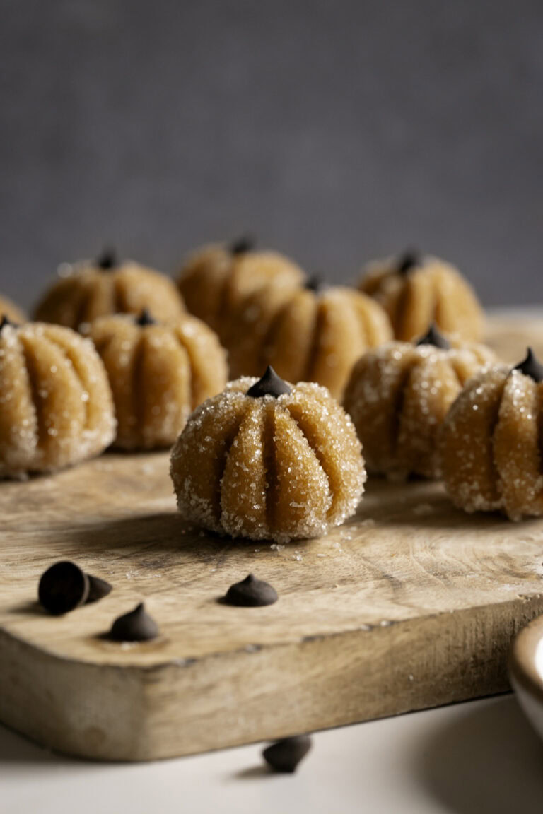 Sugared Almond Flour Pumpkin Cookie Dough on a wooden cutting board