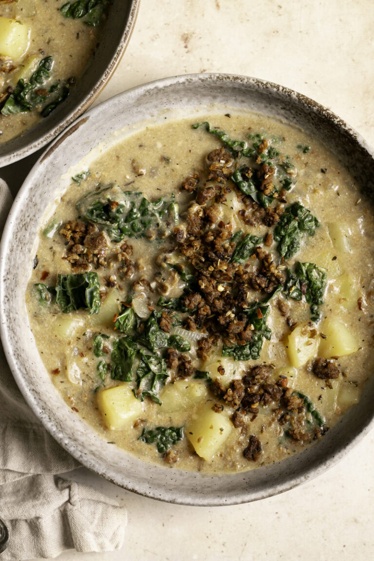 a close up of a bowl of vegan zuppa toscana soup