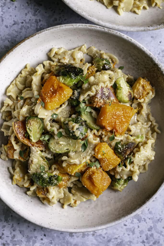 a close up of a bowl of Buttery Butternut Squash and Brussels Sprouts Pasta