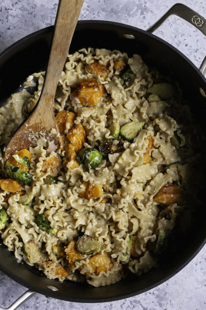 Buttery Butternut Squash and Brussels Sprouts Pasta tossed together in a dutch oven