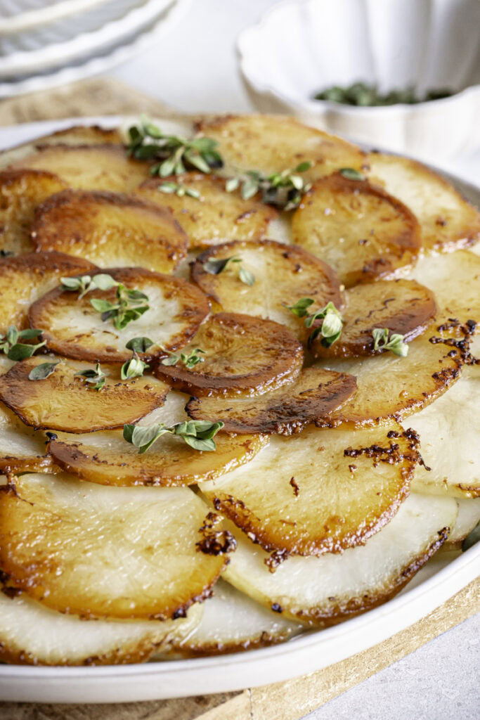 very close up image of Pommes Anna skillet potatoes on a plate