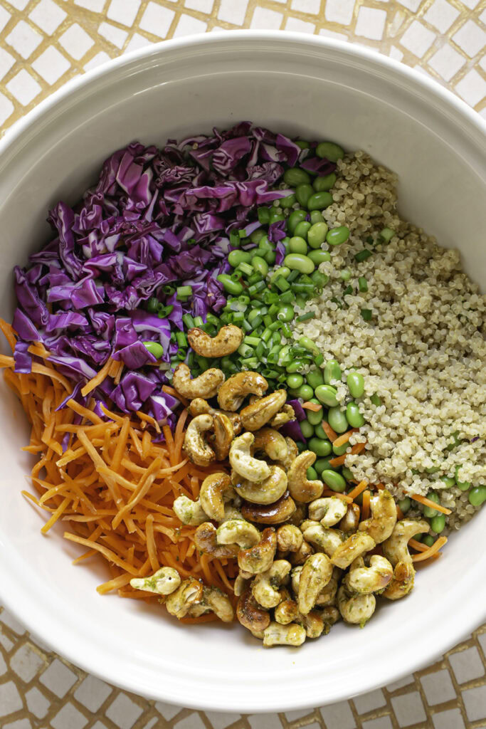 edamame quinoa salad ingredients in a large bowl.