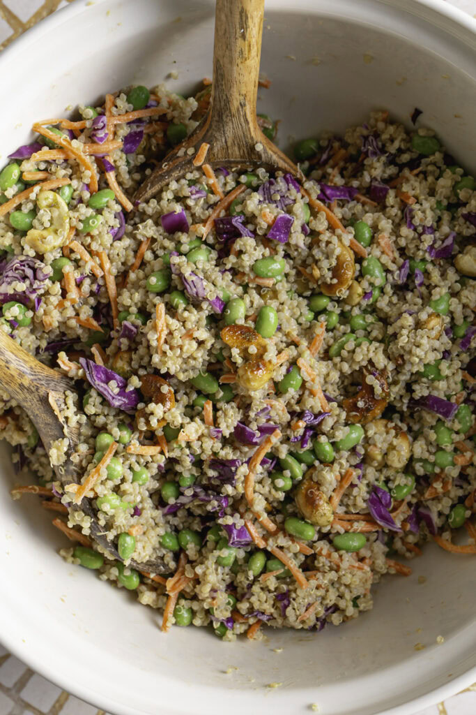 edamame quinoa salad mixed together in a large bowl.