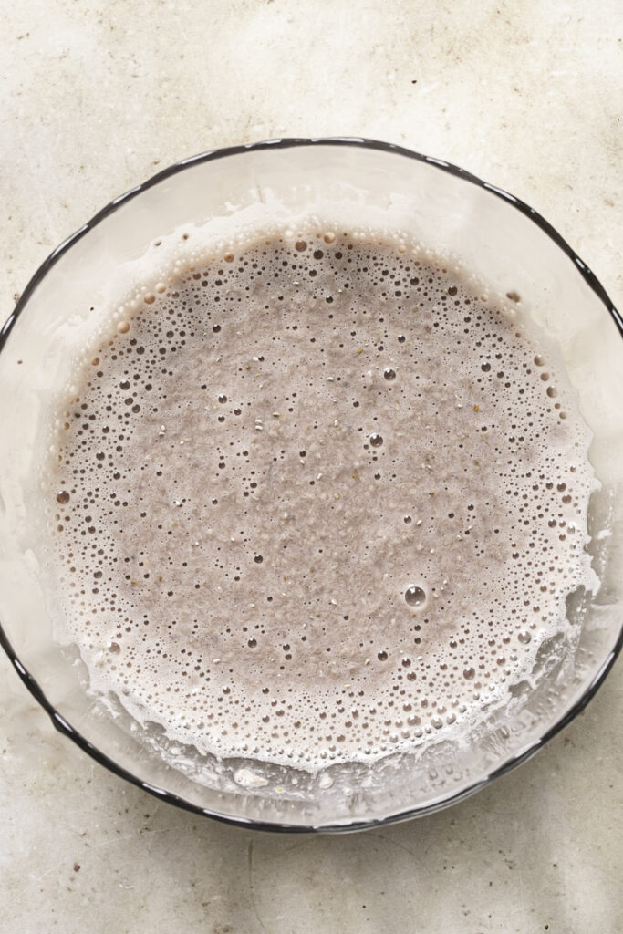 all of the chia pudding ingredients mixed together in a glass bowl.