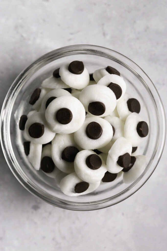chocolate candy googly eyes in a small bowl.