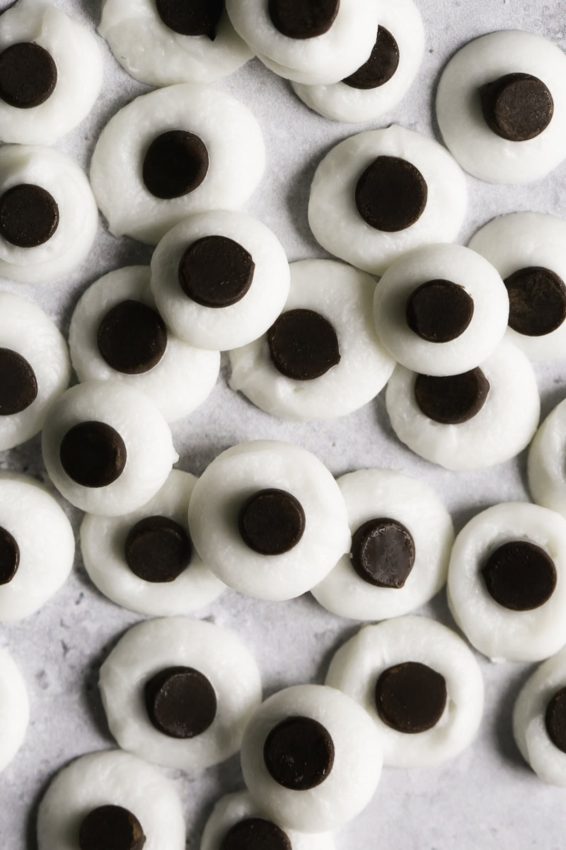 close up shot of chocolate candy googly eyes.