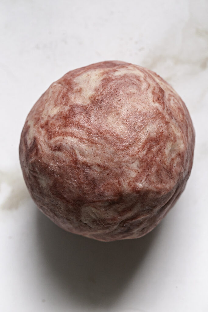 a ball of red beet dyed cookie dough.
