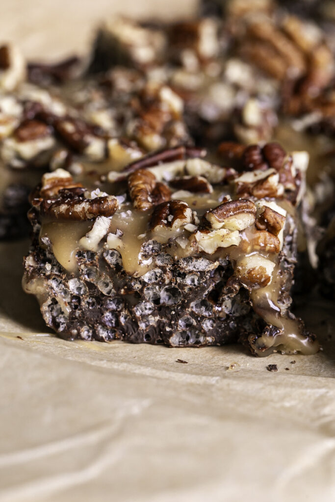 a close up of a turtle crispy rice square on a piece of parchment paper.