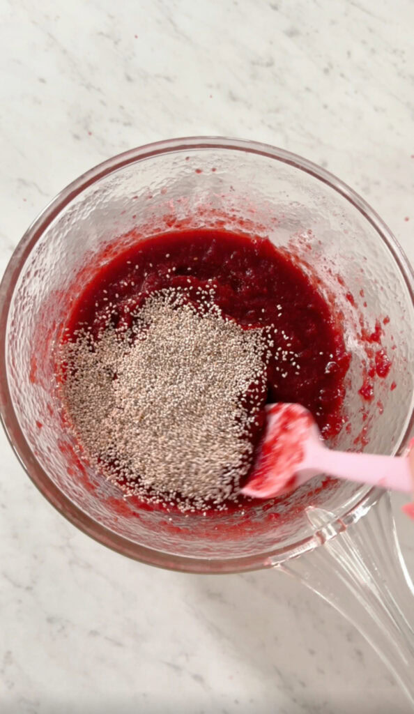 chia seeds added to the sauce pan with the strawberry beet jam.