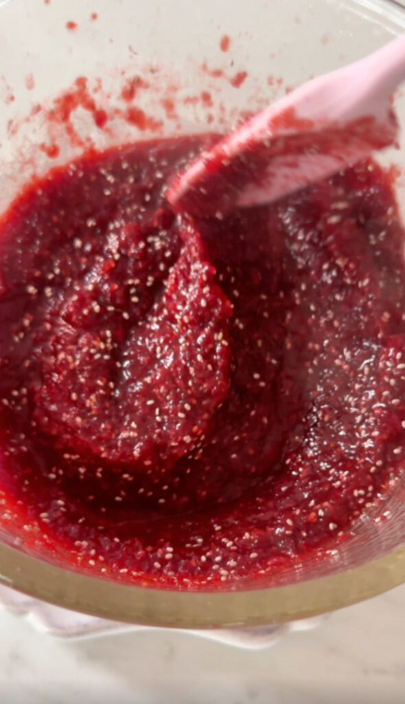 chia seeds stirred into the strawberry beet jam.
