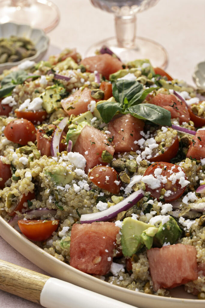 close up of watermelon quinoa salad on a serving plate.